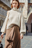 Wool sweater with high neck and flared sleeves